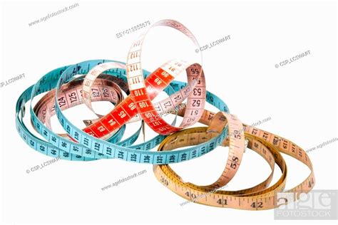 Three Tape Measures Marked In Inches And Centimetres Stock Photo