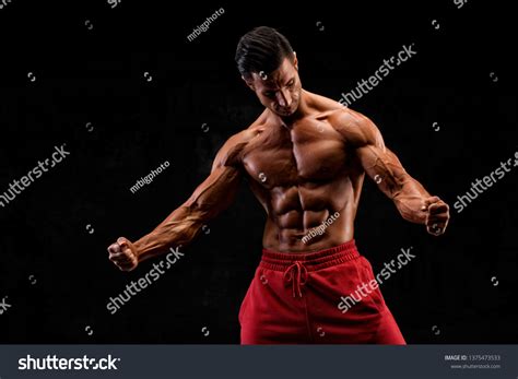 Handsome Muscular Men Flexing Muscles Stock Photo 1375473533 Shutterstock
