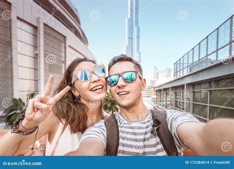 Two Friends A Man And A Woman Travel In Dubai And Take A Selfie Photo