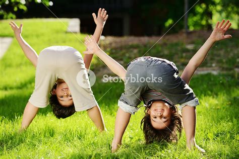 Group Of Happy Children Playing Outdoors In Spring Park Royalty Free