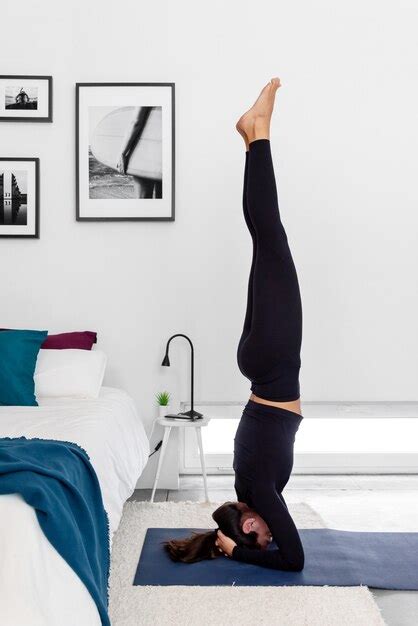 Premium Photo Fit Woman Practicing A Headstand Exercise Salamba
