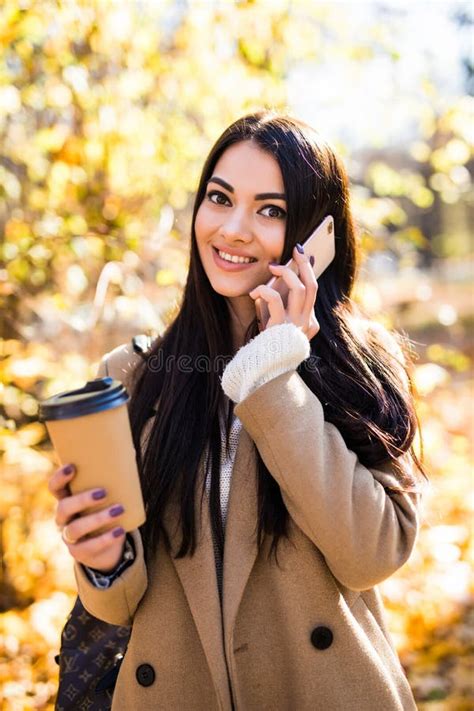 Beautiful Young Woman Talking Smartphone Walking Colorful Autumn Street