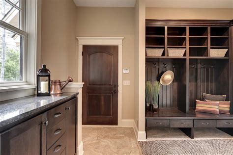 With three small children, our clients, the brazelton's, needed a mudroom that if children need to use the space, keep their dedicated storage closer to the floor so that they can reach. Custom Laundry Room Cabinets MN | Custom Mudroom Built Ins