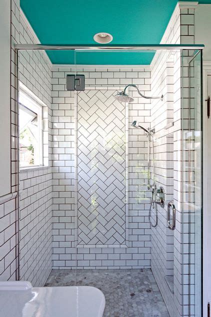 A Herringbone Tile Pattern Creates A Stunning Accent Wall In The Shower