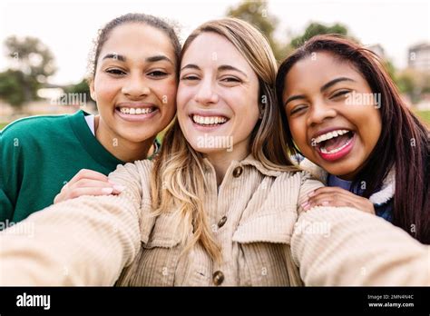 Young Group Of Three Diverse Cheerful Women Taking Selfie Together