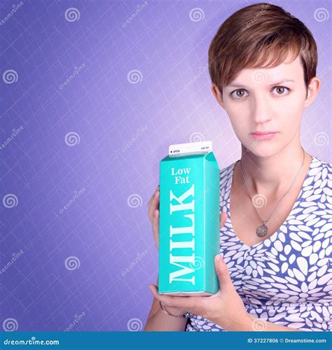 Serious Woman Holding Low Fat Milk Carton Stock Photo Image Of