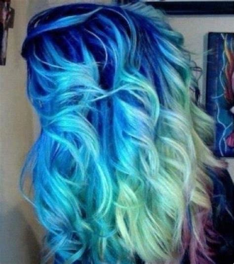 The hair is dyed in dark blue and falls over the forehead with the top. Dark blue fading into light blue fading into sea green ...
