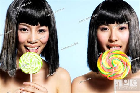 Half Naked Babe Women Licking Lollipops Smiling Stock Photo Picture And Royalty Free Image