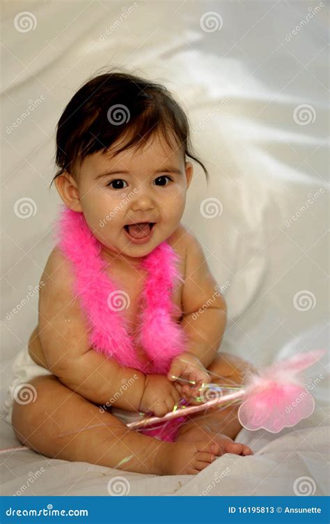 Naked Baby Sitting And Smiling With Pink Feathers Stock Photos Image