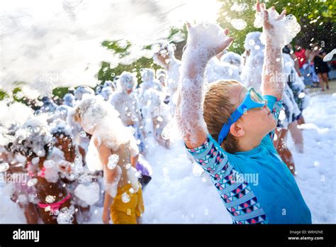 Kids Having Fun At A Soap Foam Party Stock Photo Alamy