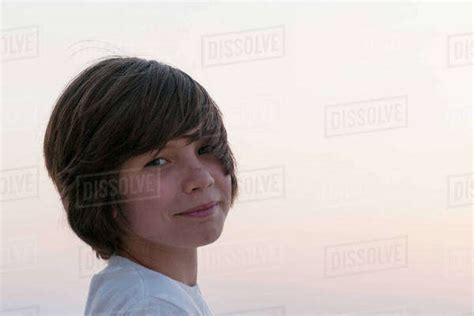 Teenage Boy Looking Over Shoulder Portrait Stock Photo Dissolve