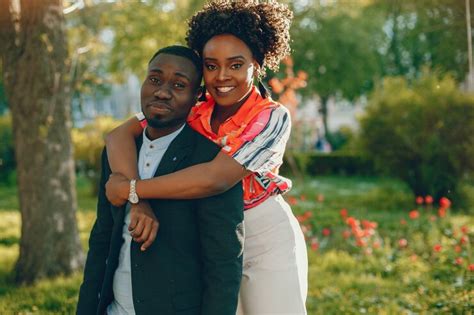 Free Photo A Young And Stylish Dark Skinned Couple Standing In A