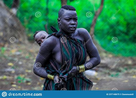 Mursi People Women In National Costumes In The Tribe Village Editorial Image Image Of African