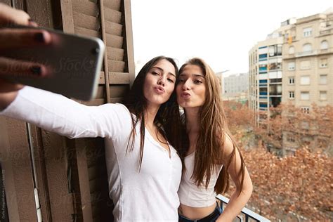 Young Girlfriends Taking Selfie On Balcony By Guille Faingold