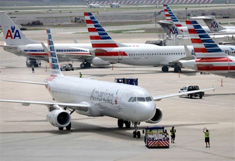 American airlines, fort worth, texas. American Airlines' new rebooking policy could mean longer waits for stranded passengers
