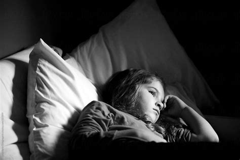 Sad Young Girl Laying In Bed By Stocksy Contributor Dina Marie