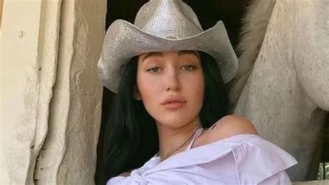 Noah Cyrus Sensually Touches Herself In Black Leather Fishnets For