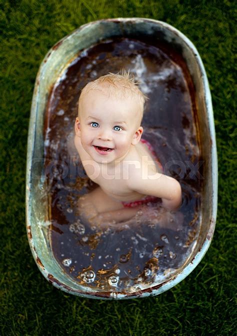 Little Boy Bathing Outside Stock Image Colourbox