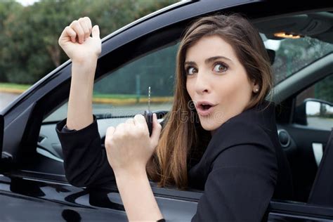 Happy Young Woman Showing Great Joy With New Car Holding Key Stock