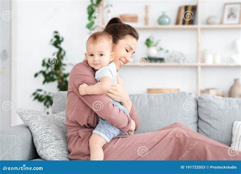 Mother Baby Bonding Loving Mom Cuddling Her Adorable Infant Son At