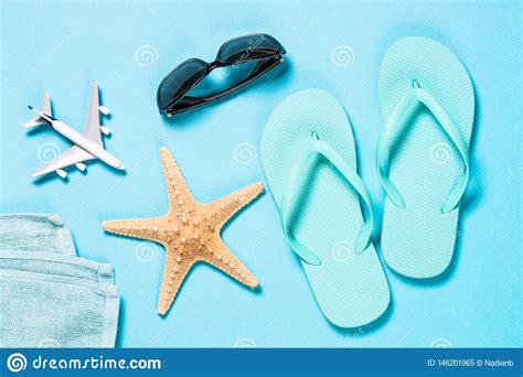 Blue Flip Flops Sunglasses And Starfish On Blue Background Stock