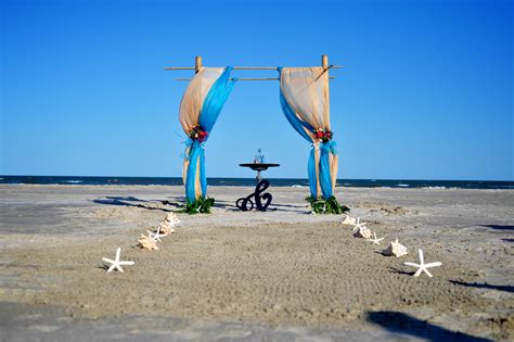 Bamboo Arch Burlap And Teal Drapes Sand Ceremony Seashells And