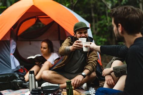 Premium Photo Friends Camping In The Forest Together