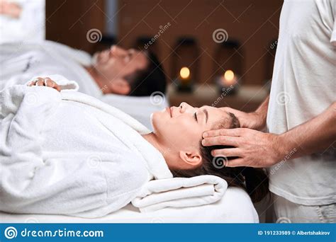 Beautiful Young Woman Receiving Massage On Head And Shoulders Zone In