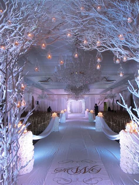 White Reception Winter Wedding Decor With White Painted Tree Branches