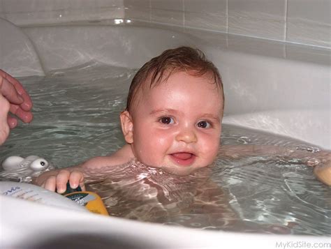 In generations past, most babies got all their scrub downs in the kitchen sink. Baby In Bath Tub