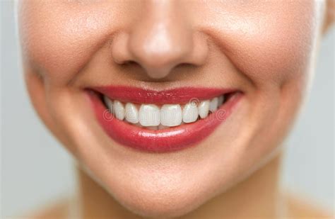 Close Up Of Woman Mouth With Beautiful Smile And White Teeth Stock