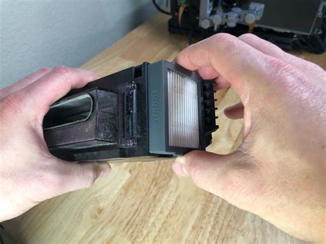 Press the button on top of this tray and remove it. How to Replace the Filter on Your Roomba i7 - Howchoo
