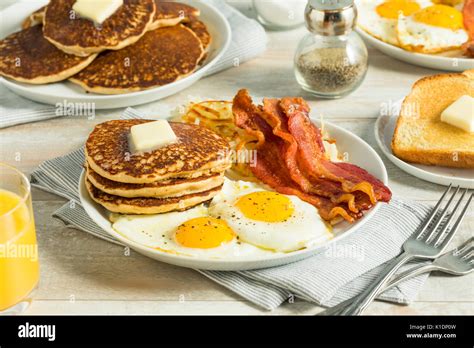 Healthy Full American Breakfast With Eggs Bacon And Pancakes Stock