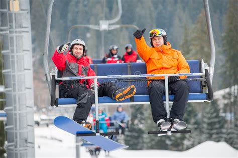 Skier And Snowboarder Riding Up On Ski Lift Stock Photo Image Of Extreme Bukovel