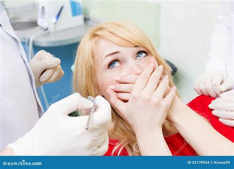 Female Patient In Dentist Office Afraid Of Doctor Procedure Stock