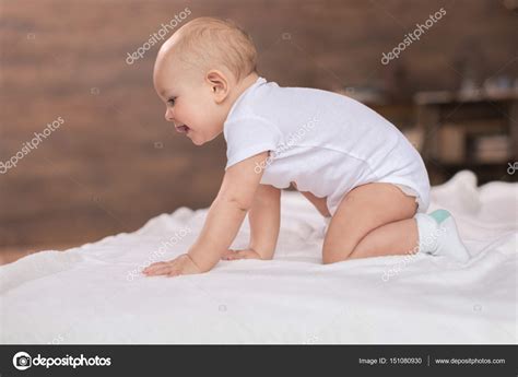Cute Baby Boy On Bed — Stock Photo © Lenamiloslavskaya 151080930