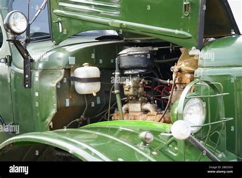 View of the Engine of an old restored truck through the open bonnet