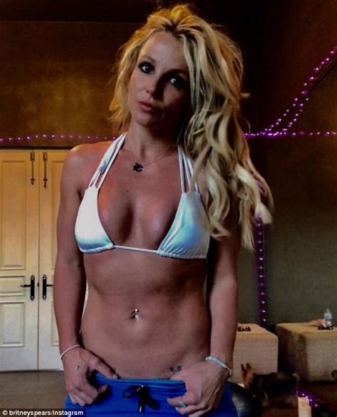 Britney Spears Shows Off Her Cleavage And Washboard Abs Daily Mail Online