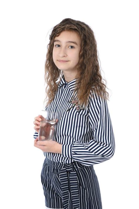 Beautiful Young Girl Holding A Glass Of Clean Mineral Water In Her Hand