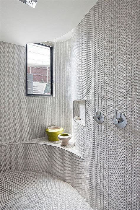 Used as a platform for the white porcelain sink, this arrangement the mosaic tile designs are featured on two bathroom walls, creating a hip area of the room. 30 Ideas of using round mosaic bathroom tiles