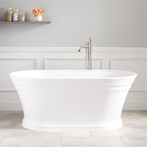 A classic freestanding bathtub opposite an indoor fireplace. Odenwald Acrylic Freestanding Tub - Bathroom