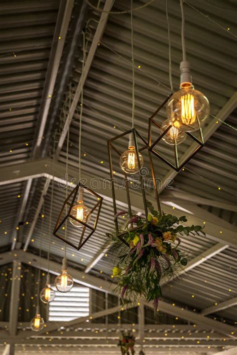 Beautiful Bohemian Wedding Flowers Hanging From Chandeliers In The