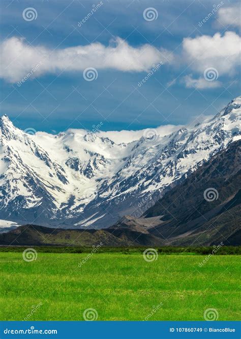 Mountain Ranges And Green Grass Field Landscape Stock Image Image Of