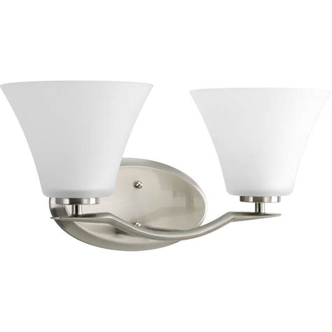 The luna bath light fixture features a row of classic bell shaped glass shades that illuminates your bathroom vanity, creating a versatile centerpiece that coordinates with a variety of decor. Progress Lighting Bravo Collection 2-Light Brushed Nickel ...