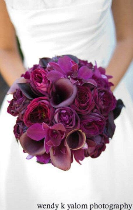 Currently, fall weddings are all about moody shades or on the contrary, bright colors, and the wedding bouquets are done accordingly. bridesmaid bouquets: wine and deep plum color flowers in a ...