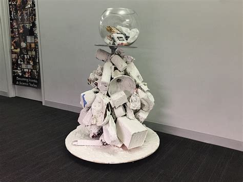 Eco-Friendly Art: Upcycled Sculpture "The Ghost of Consumption" - Go