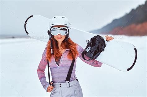 Beautiful Redhead Girl In Protective Helmet And Goggles Holding A