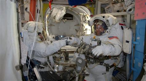 veteran spacewalkers connect new space station batteries race through long task list