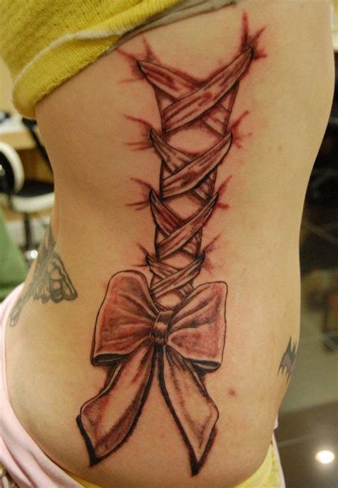 30 Cute Ribbon Tattoos For Women Cuded Rib Tattoo Corset Tattoo Girl Rib Tattoos