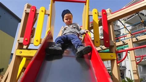 Kids Playground With Slide Carousel And Other Toys Children Playing On